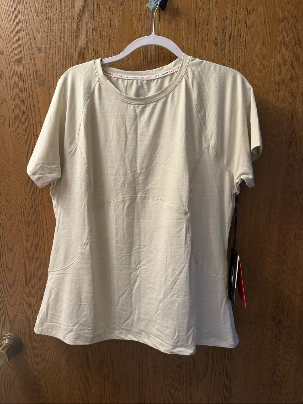 Spyder Women's Short Sleeve Performance Tee in Light Cream